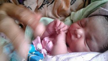 Newborn abandoned at a dustbin