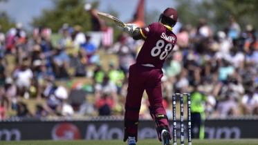 West Indies batsman Darren Sammy plays a shot 