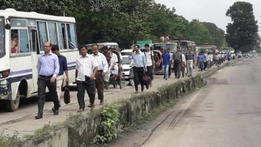 Commuters walk towards their destination 