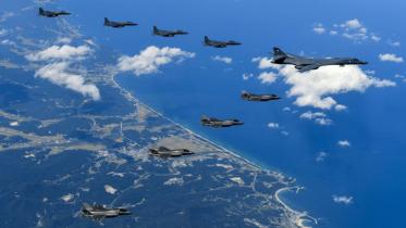 US bombers and fighter escorts fly off the coast of North Korea in a show of force against its nuclear weapons program, escalating already sky-high tensions.