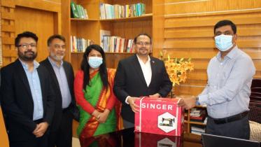coca-cola_ibpl_distributes_sewing_machine.jpeg