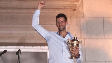 Serbia's Novak Djokovic celebrates his victory at the Wimbledon tennis tournament with supporters during a welcoming ceremony in Belgrade.