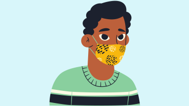 A young person wearing a mask