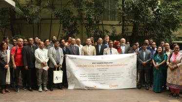 4_-_attendees_pose_together_with_the_event_banner_at_the_premises.jpg