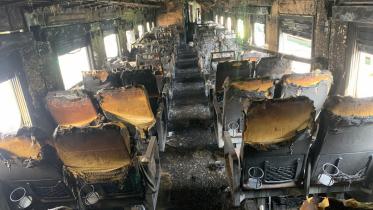 Three coaches of Mohanganj Express were set on fire near Tejgaon Railway Station area of Dhaka on December 19. The photo was taken from Kamalapur Railway Station. Photo: Sk Enamul Haq