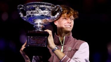 Jannik Sinner celebrates with the trophy after winning the final against Russia's Daniil Medvedev on January 28. PHOTO: REUTERS