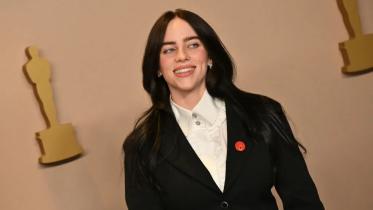 Stars wear red pins to the Oscars to call for ceasefire in Gaza