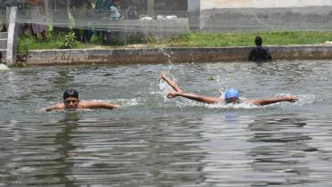 Pool lies empty as Bogura swimmers train in ponds