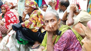 Group of elderly people waiting to collect their old age allowance.