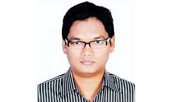an associate professor of economics at the University of Dhaka
