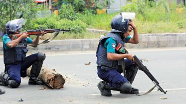 police-aim-quota-protest.jpg