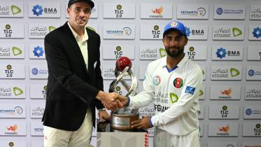tim_southee_and_hashmatullah_shahidi.jpg