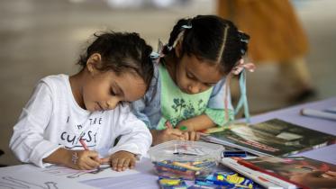 Two children drawing 