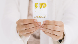 eid-al-fitr-concept-with-hands-showing-card.jpg