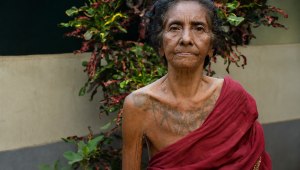 01_Chumki Kisku with her body marking- photo by Samar M Soren.png