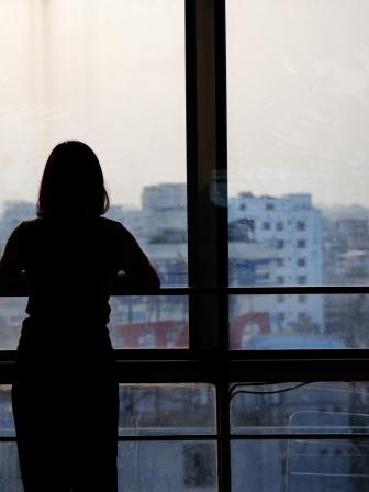 Person looking out a window